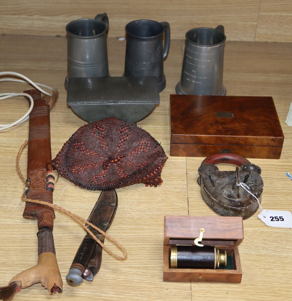A quantity of mixed collectables including a planished pewter box, a draughtsman set, a large padlock and key, daggers etc